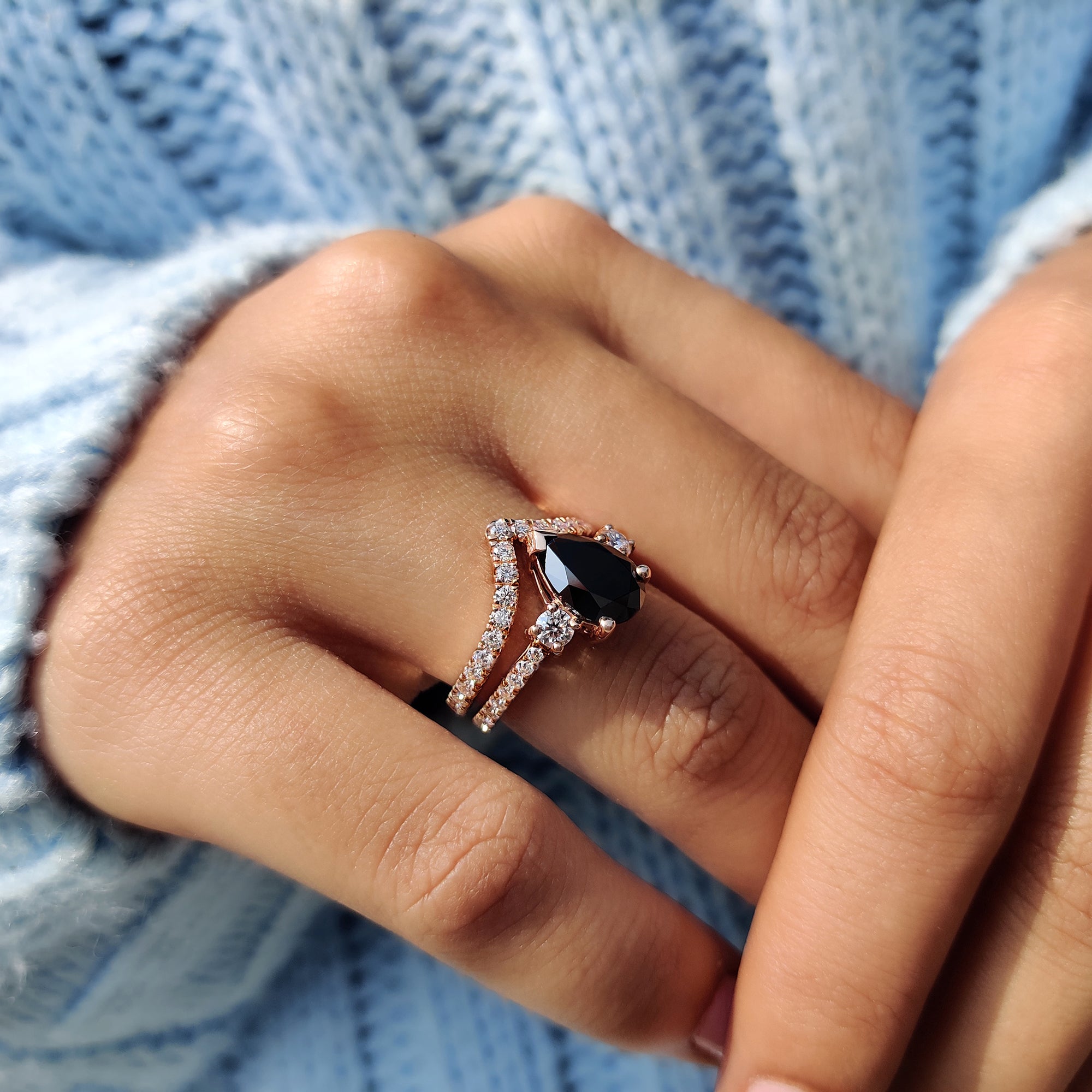 V shape band paired with a 3 stone engagement ring in a Moissanite set.
