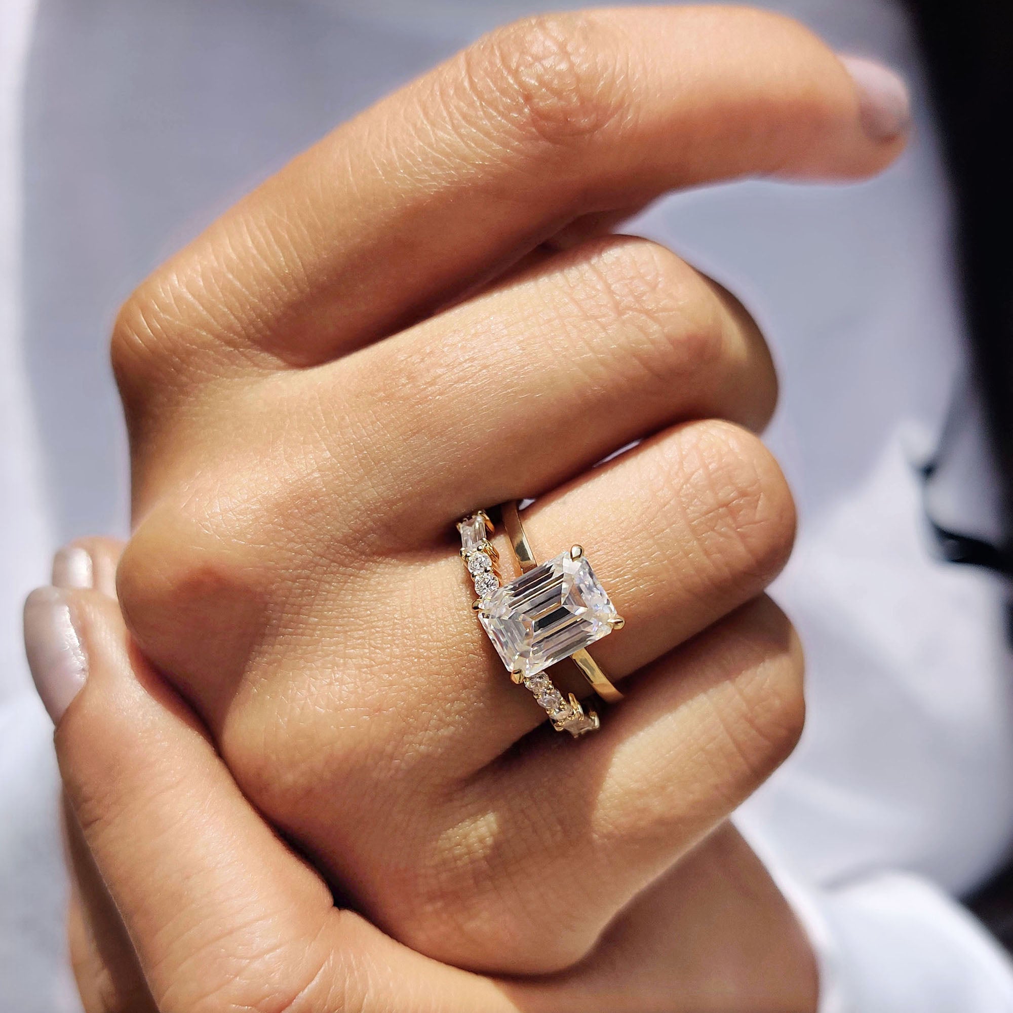 Full eternity wedding band stacked with a round cut halo ring.
