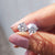 Round cut Moissanite Earrings designed with 3 prong setting and white gold earrings for handmade jewelry.
