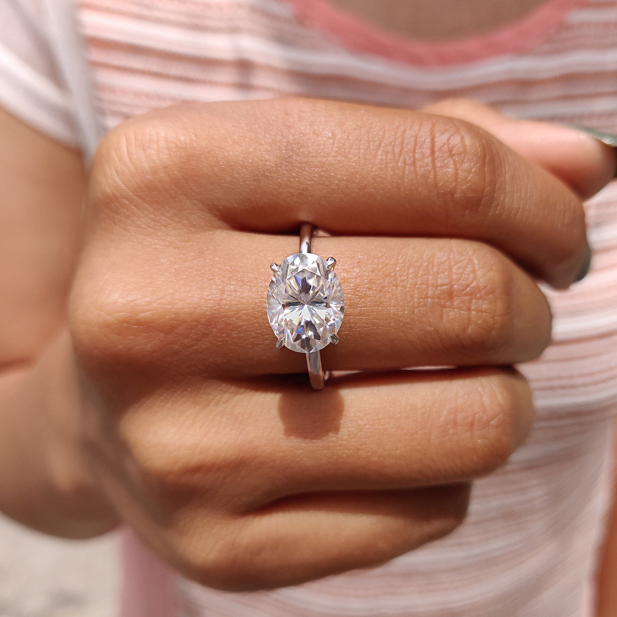 Oval engagement ring with a 4 prong setting.