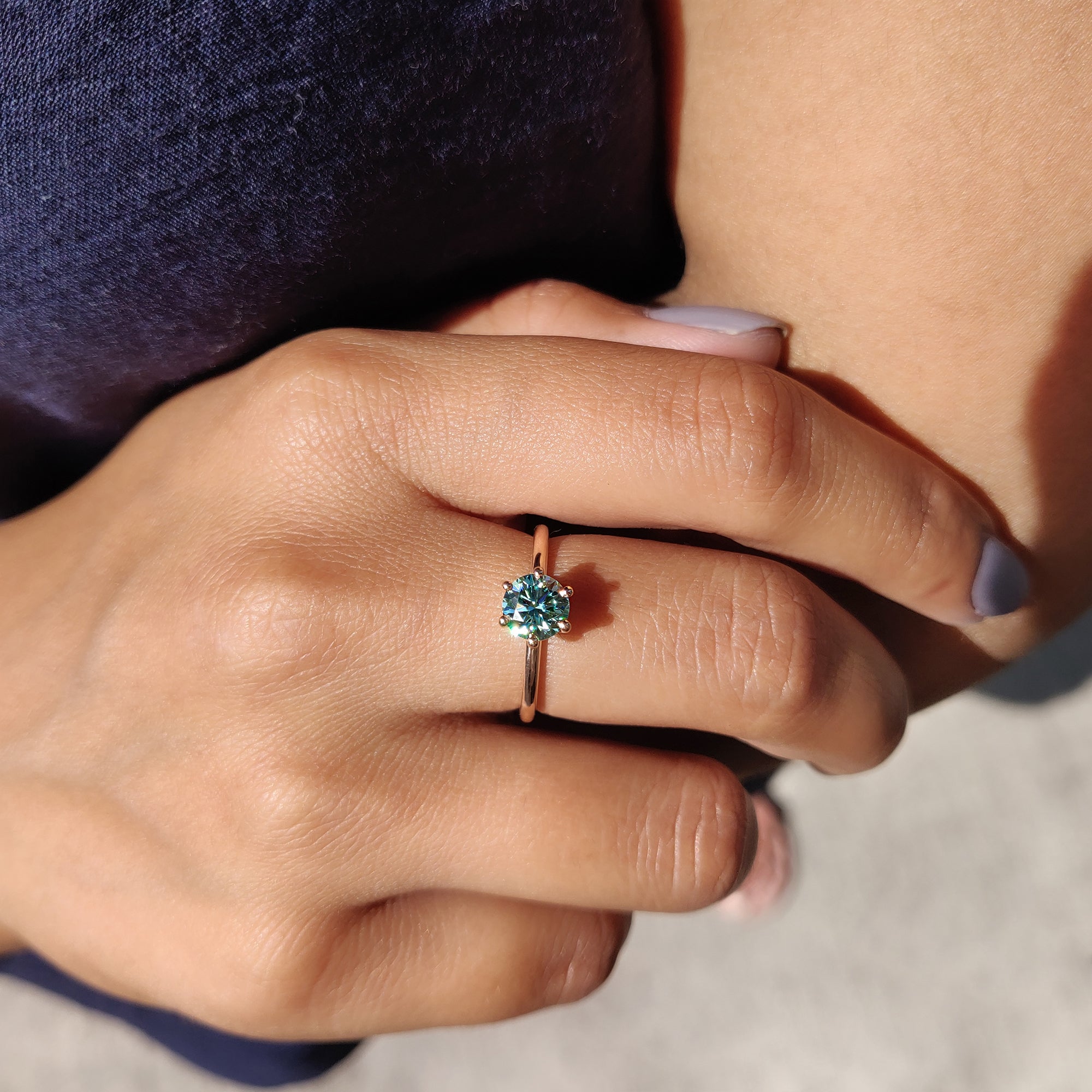 A rose gold engagement ring brings warmth and elegance to the design.
