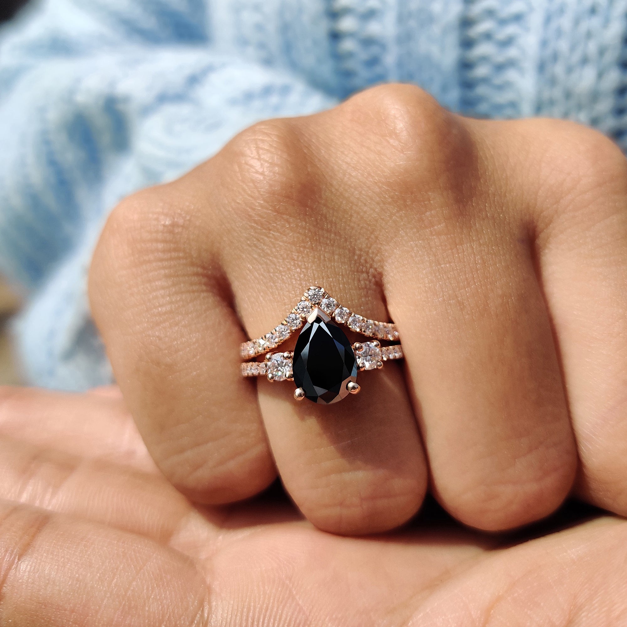 Round cut wedding band paired with a pear engagement ring in rose gold.
