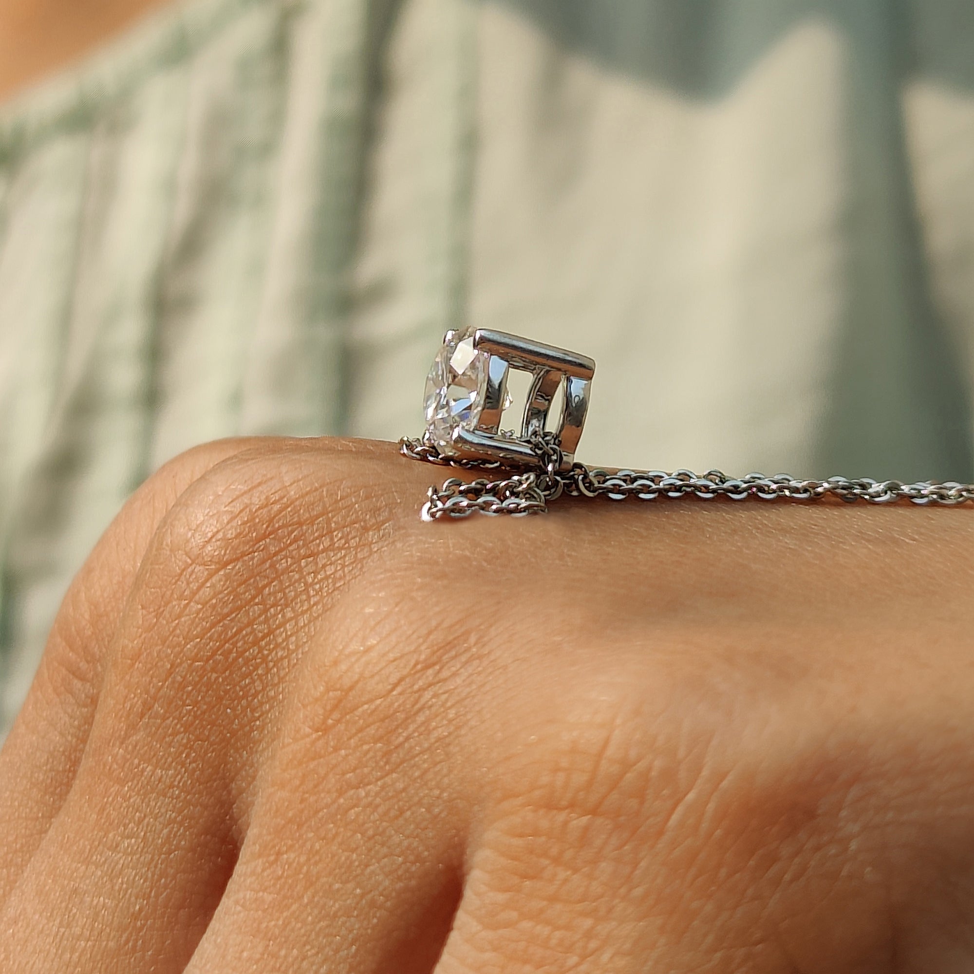 Four prong set pendant created in white gold with a custom pendant finish.

