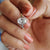 This oval bezel engagement ring features a modern and secure design.
