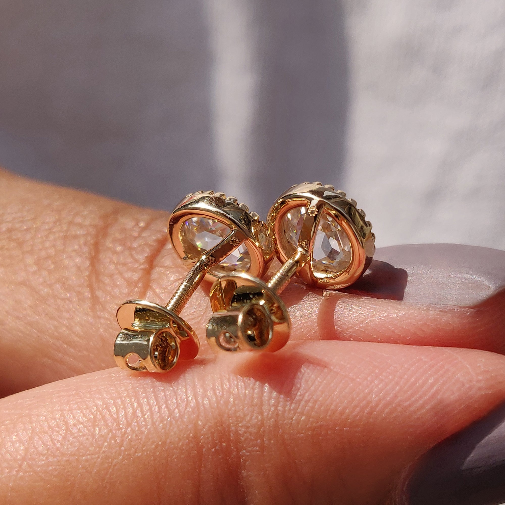 Stud Earrings with round rose cut design in yellow gold from carat Diamonds earrings.
