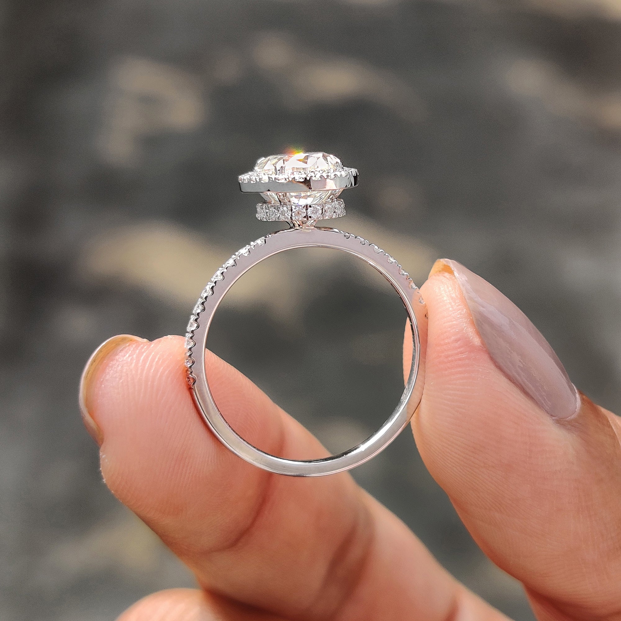 A halo round cut ring offers a timeless design with added brilliance.

