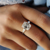 A 3 stone emerald cut moissanite ring symbolizes love, past, present, and future.