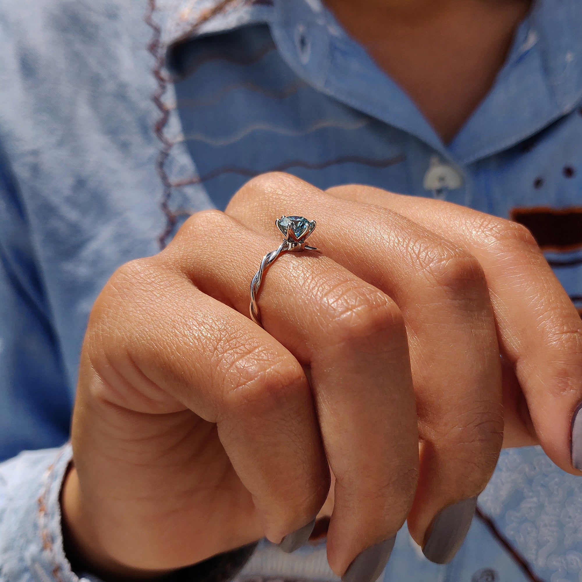 The gold moissanite ring offers a luxurious, ethical alternative to diamonds.
