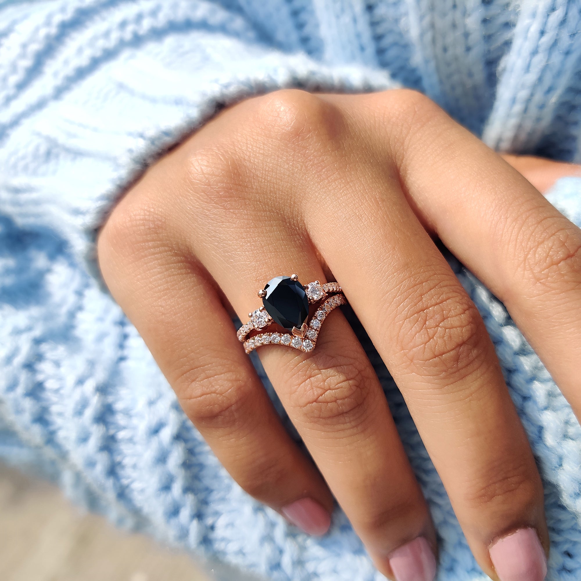 3 stone engagement ring with pave setting in a rose gold handmade bridal set.
