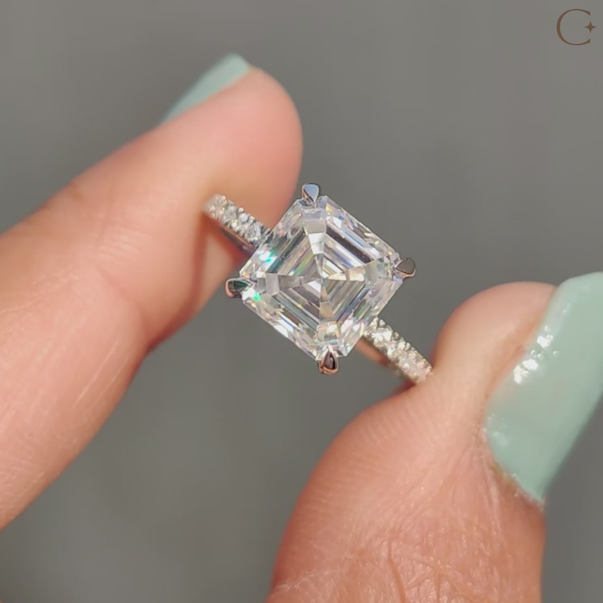 Pave setting band holding asscher cut moissanite.
