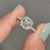 Pave setting band holding asscher cut moissanite.
