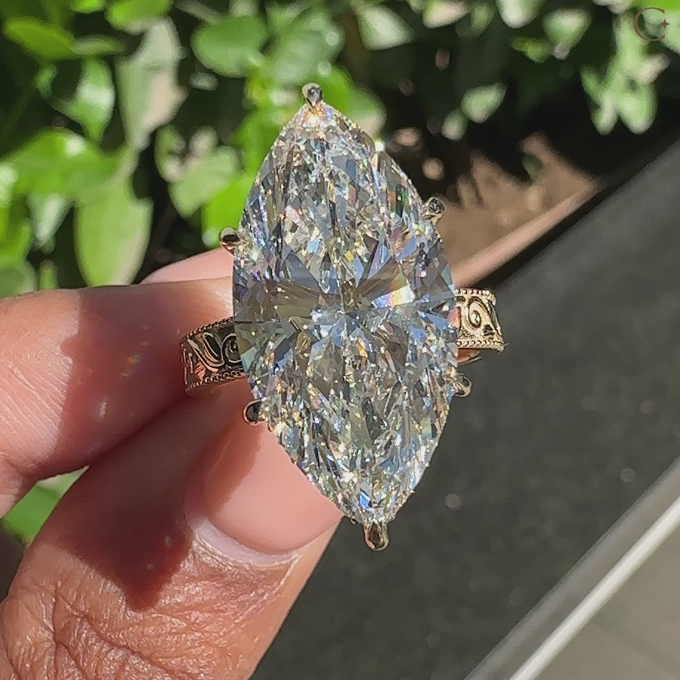 Hidden halo Marquise Diamond Ring with round diamond accents
