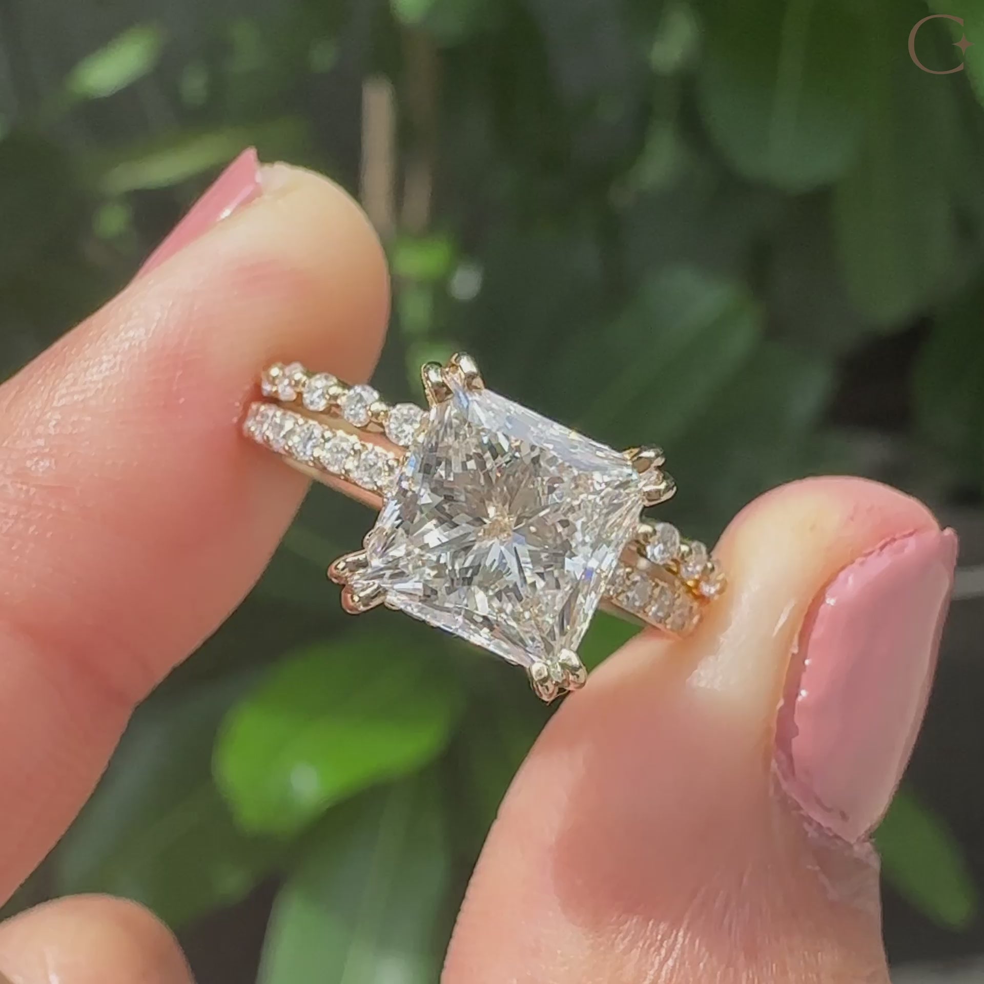 Princess cut diamond engagement ring with pave setting ring.

