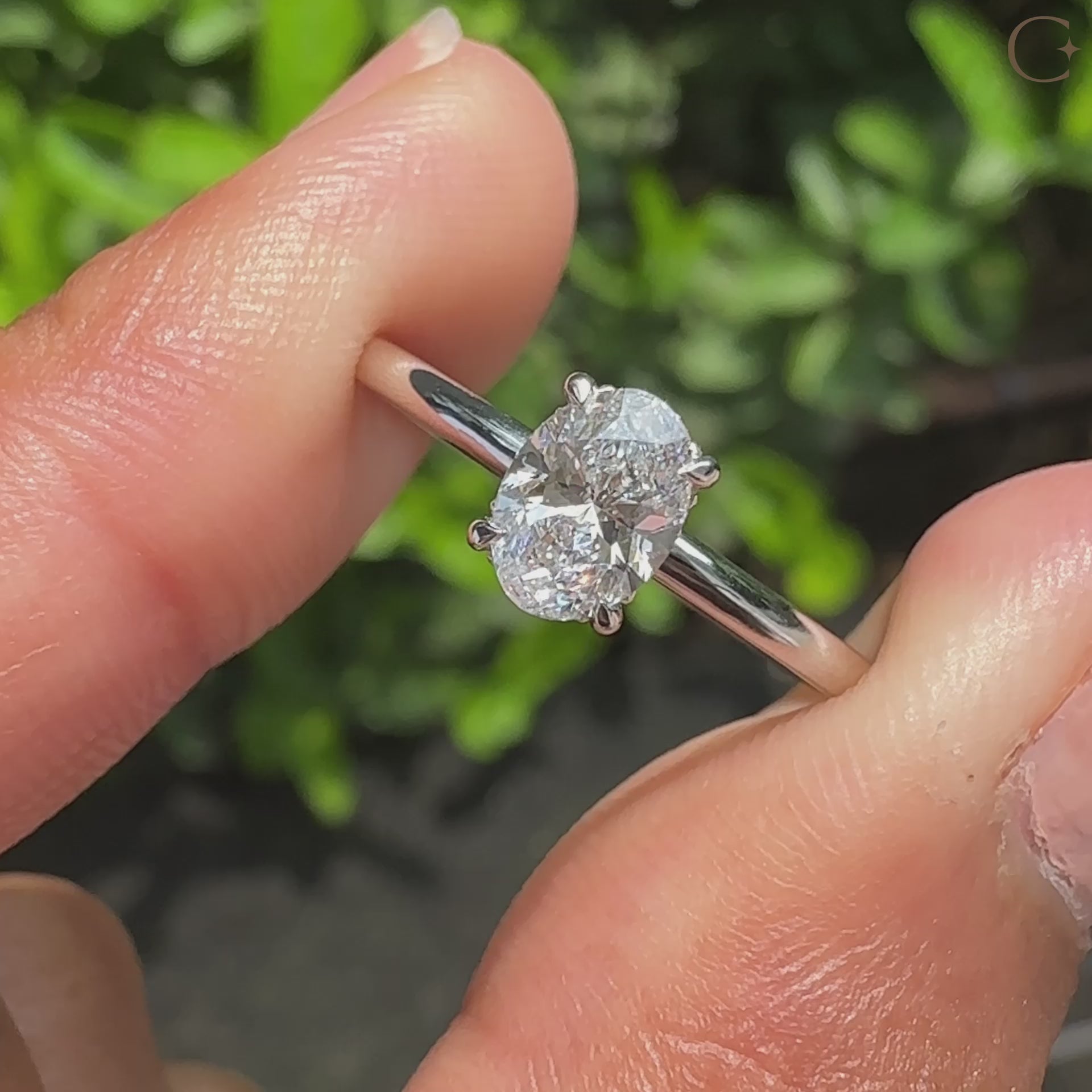 Oval cut engagement ring paired with hidden halo engagement ring.
