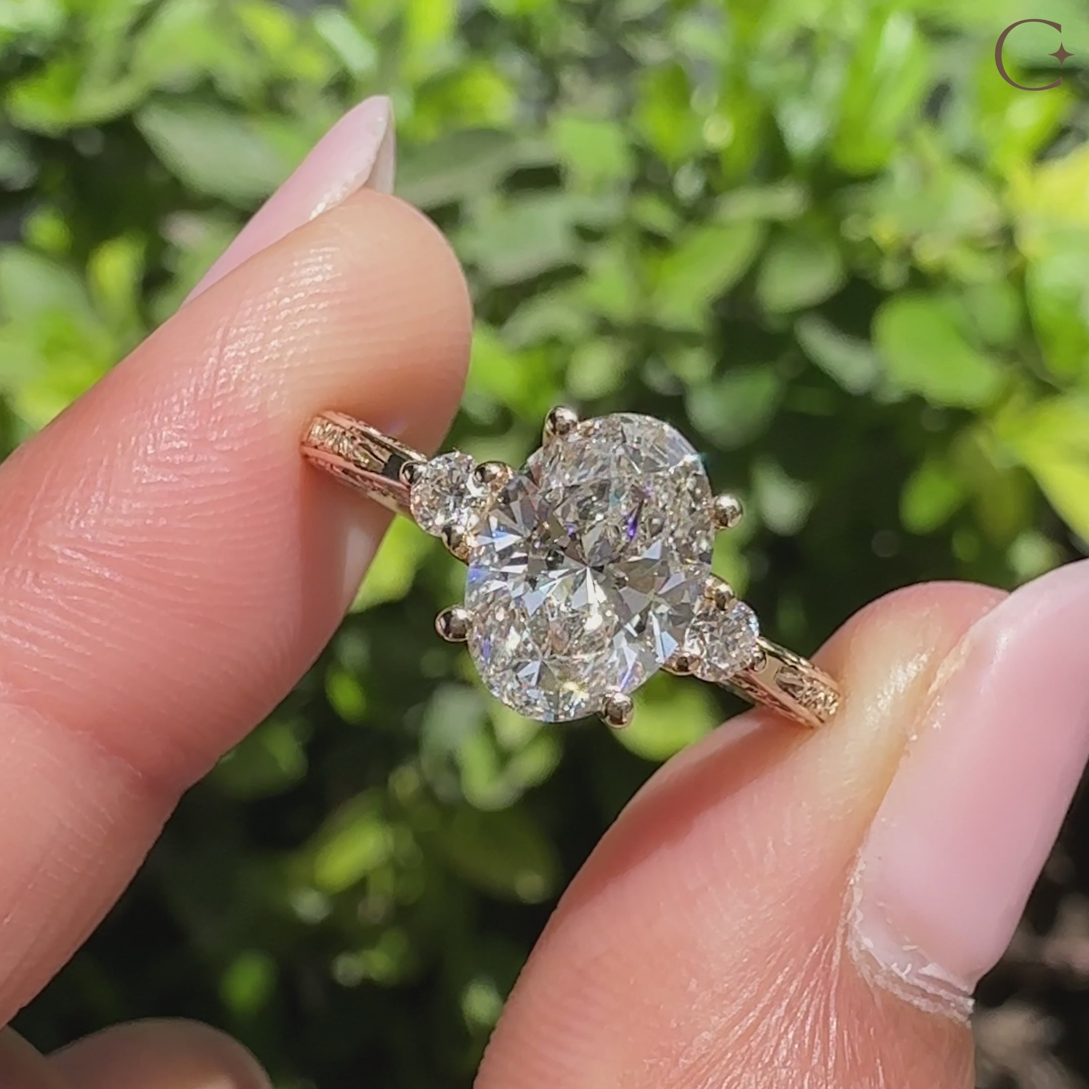 Lab grown oval diamond ring with round side accents.