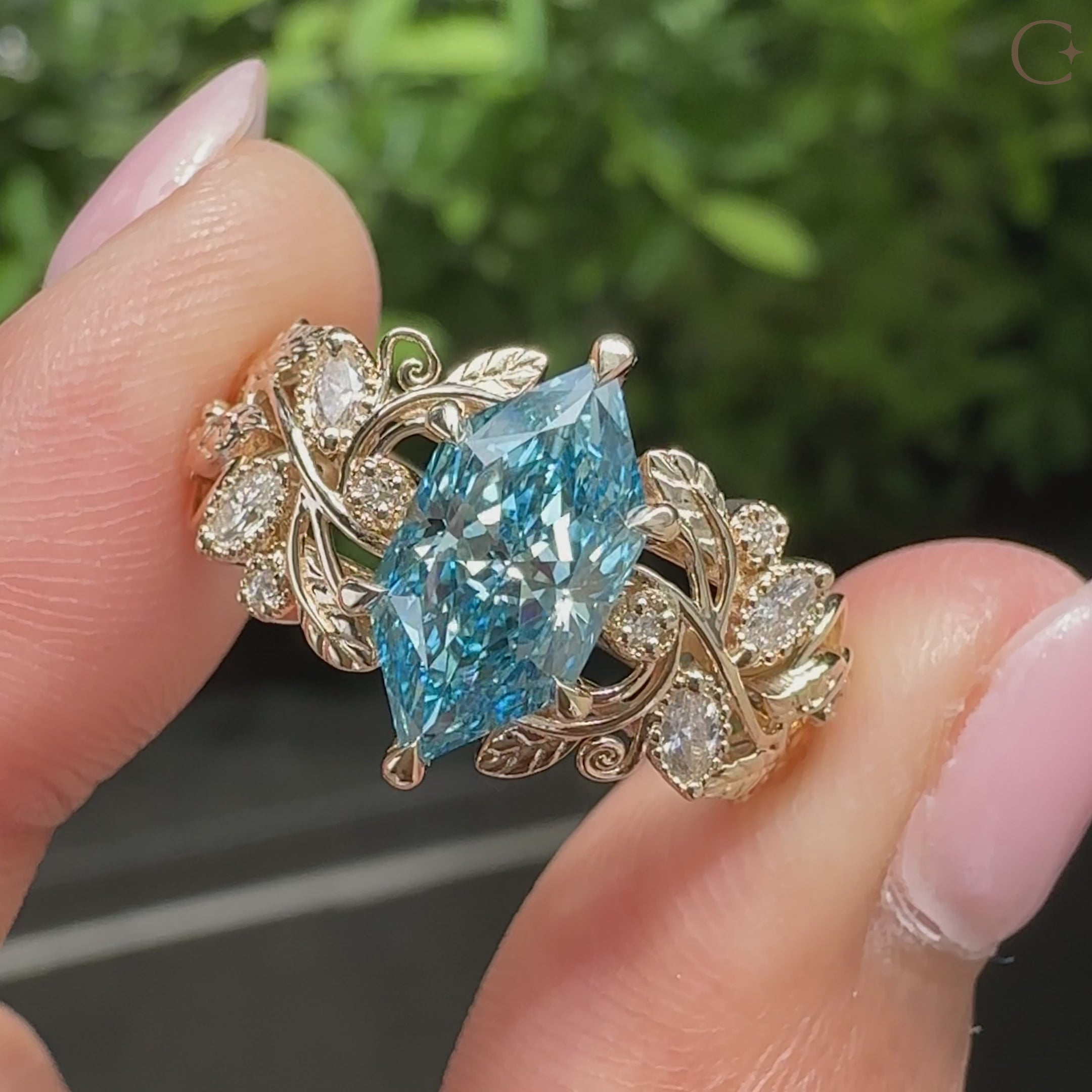 Blue Dutch marquise diamond with marquise and round side stones
