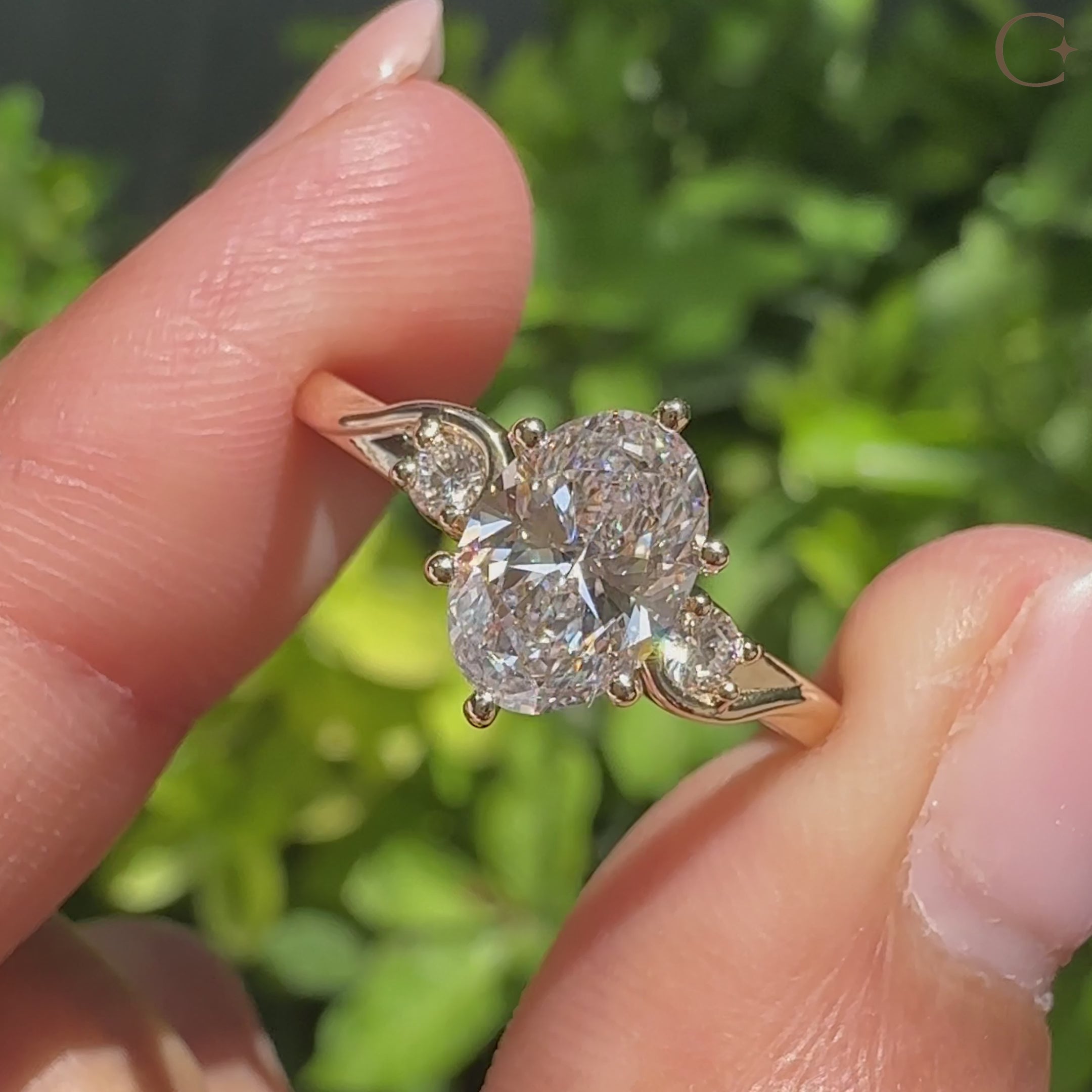 Oval cut diamond ring with basket setting and side stones