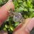 Nature inspired oval diamond ring with marquise side stones.

