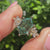 Hexagon ring with marquise and round side stones.
