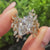 Marquise engagement ring with nature inspired wrap guard band