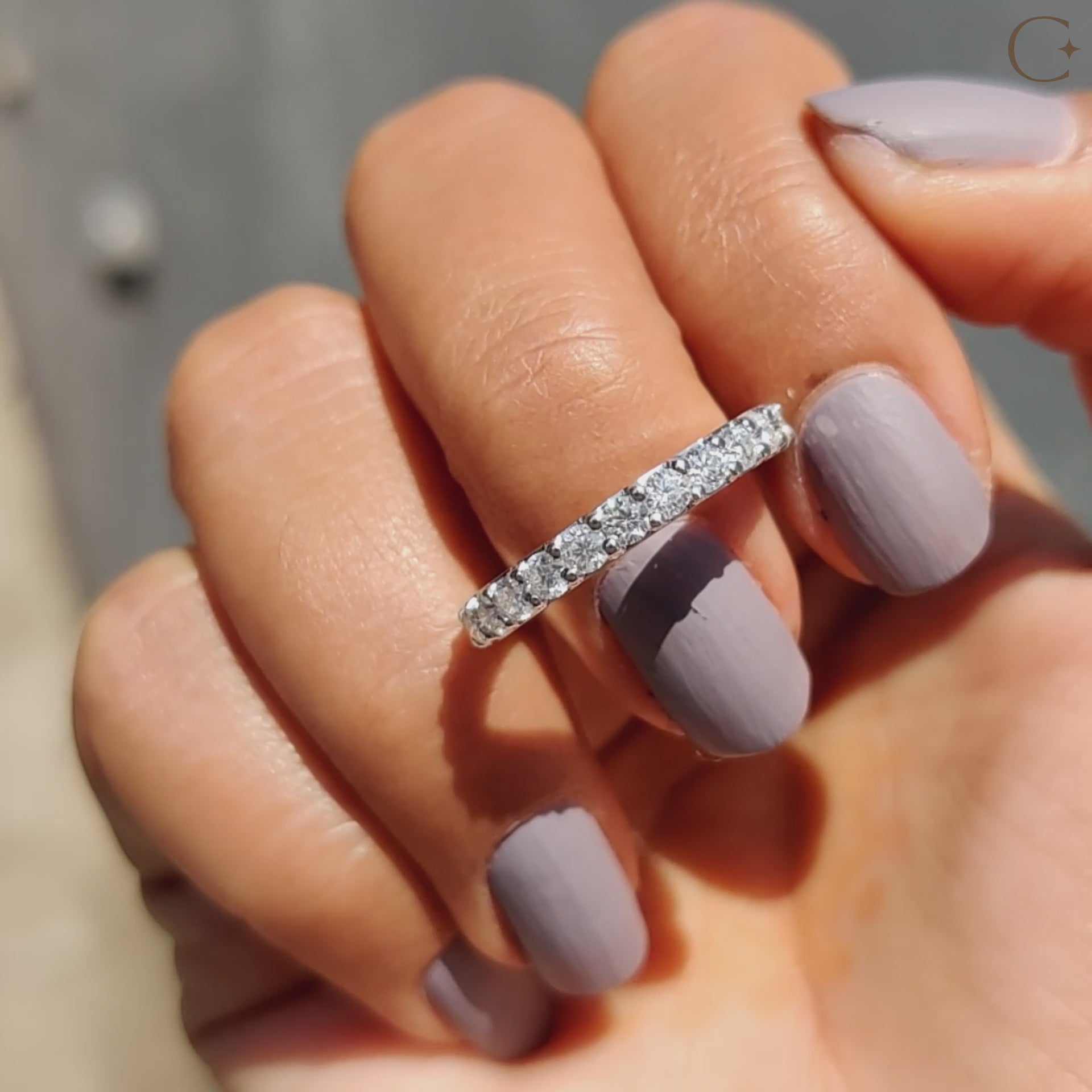 White gold moissanite band with prong set wedding band.