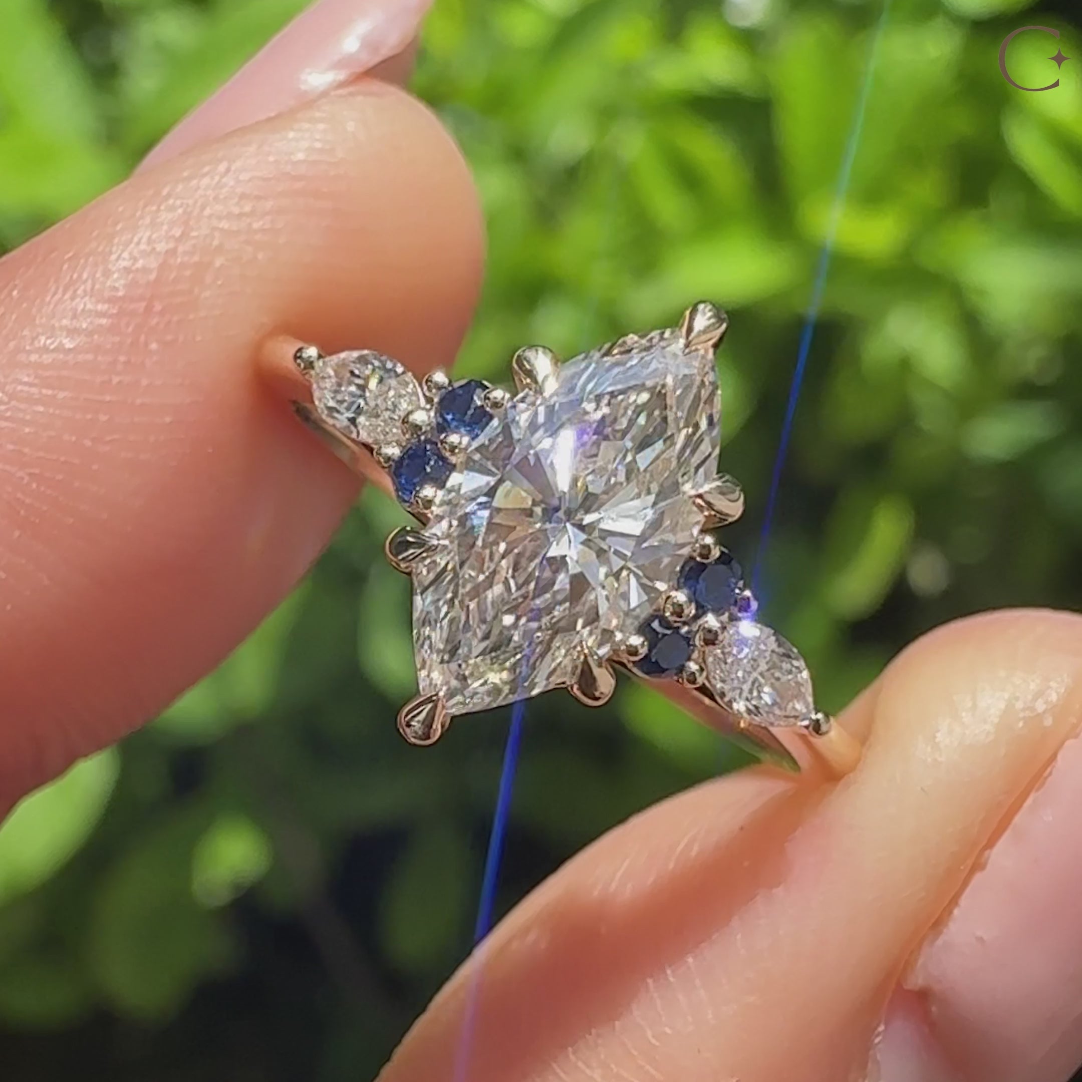 Marquise cut diamond ring with sapphire and tapered ring