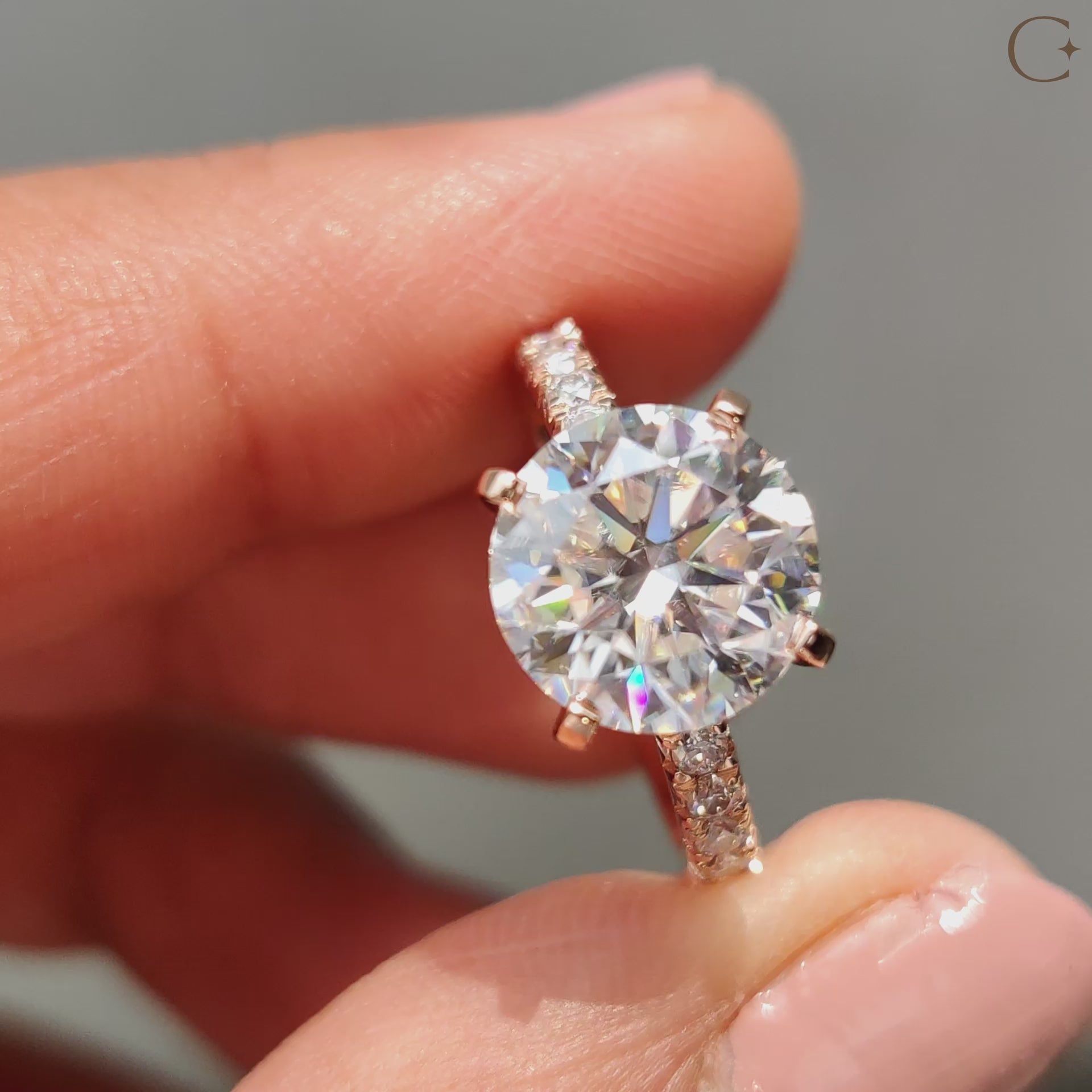 Hidden halo engagement ring captures soft secret shine.