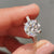 Hidden halo engagement ring captures soft secret shine.