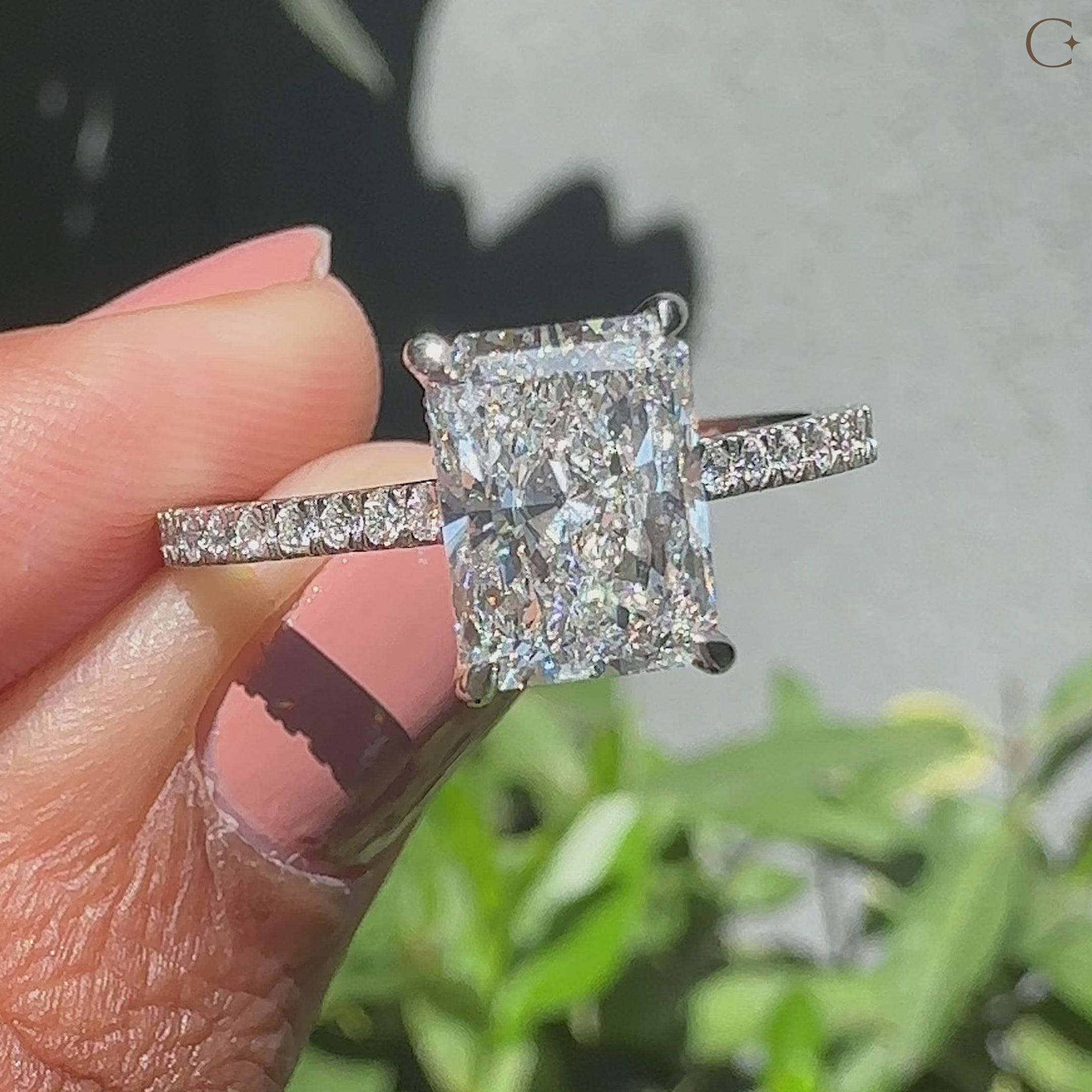 Four claw prong in cathedral setting engagement ring style.
