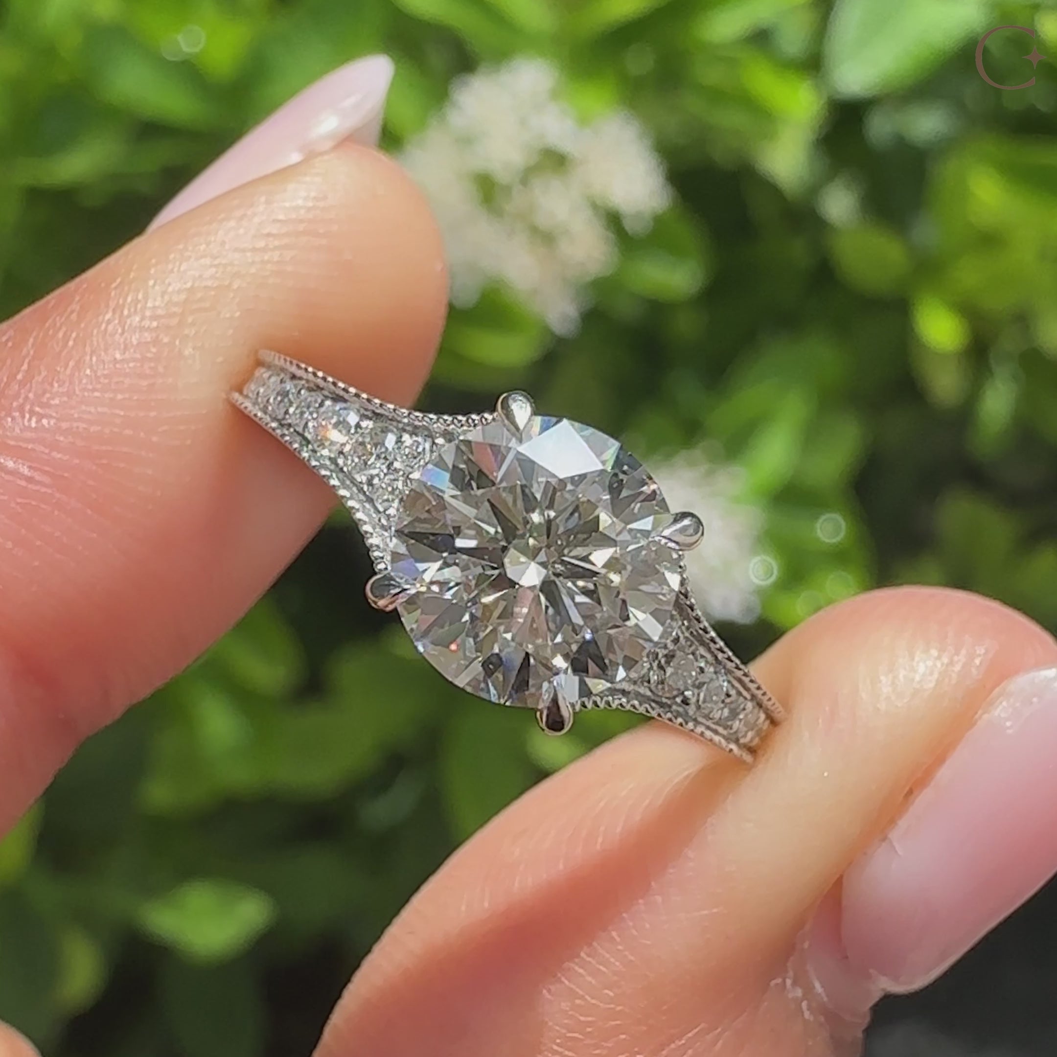 Round diamond engagement ring with round diamonds pave setting
