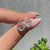 Handmade Libra stud earrings featuring halo diamond design.
