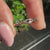 Rose gold three stone wedding band with round cut diamonds and minimalist style.
