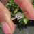 A stunning princess cut solitaire diamond ring with a cathedral setting, crafted in yellow gold.
