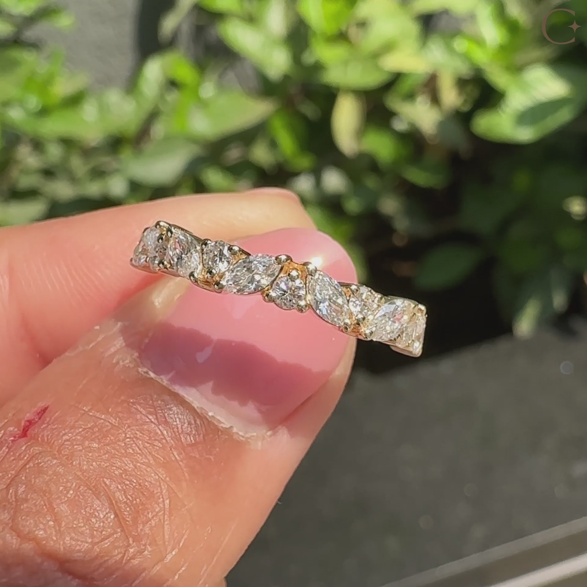 Marquise diamond band with a delicate shared prong setting.
