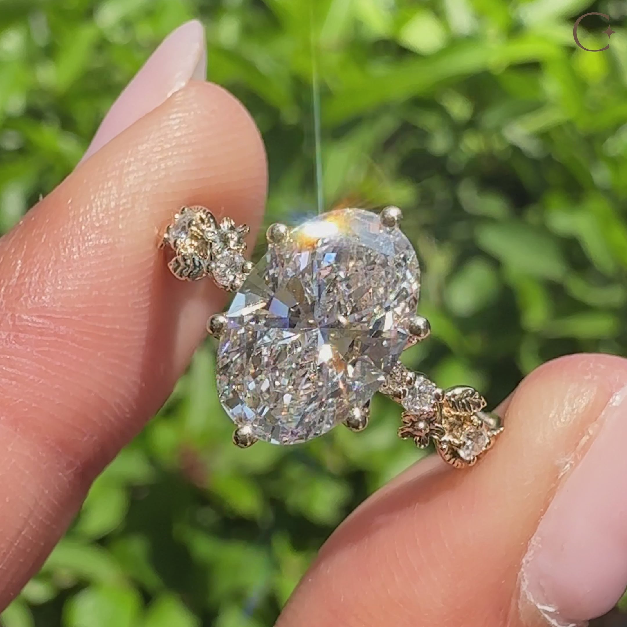 Oval diamond Sakura flower engagement ring.

