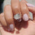 Solitaire engagement ring shown with a classic round center stone