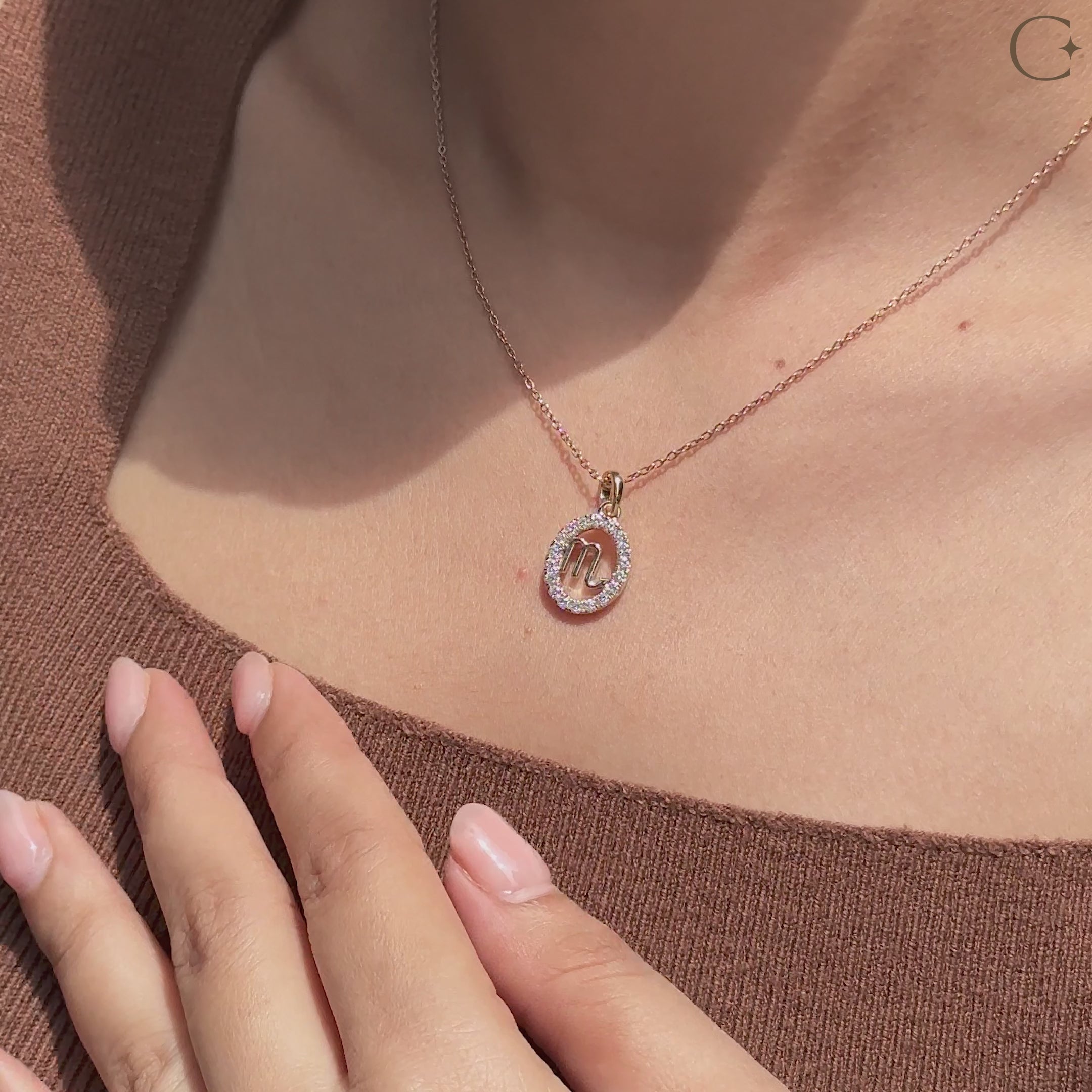 Handmade Scorpio pendant in yellow gold with halo diamond design.