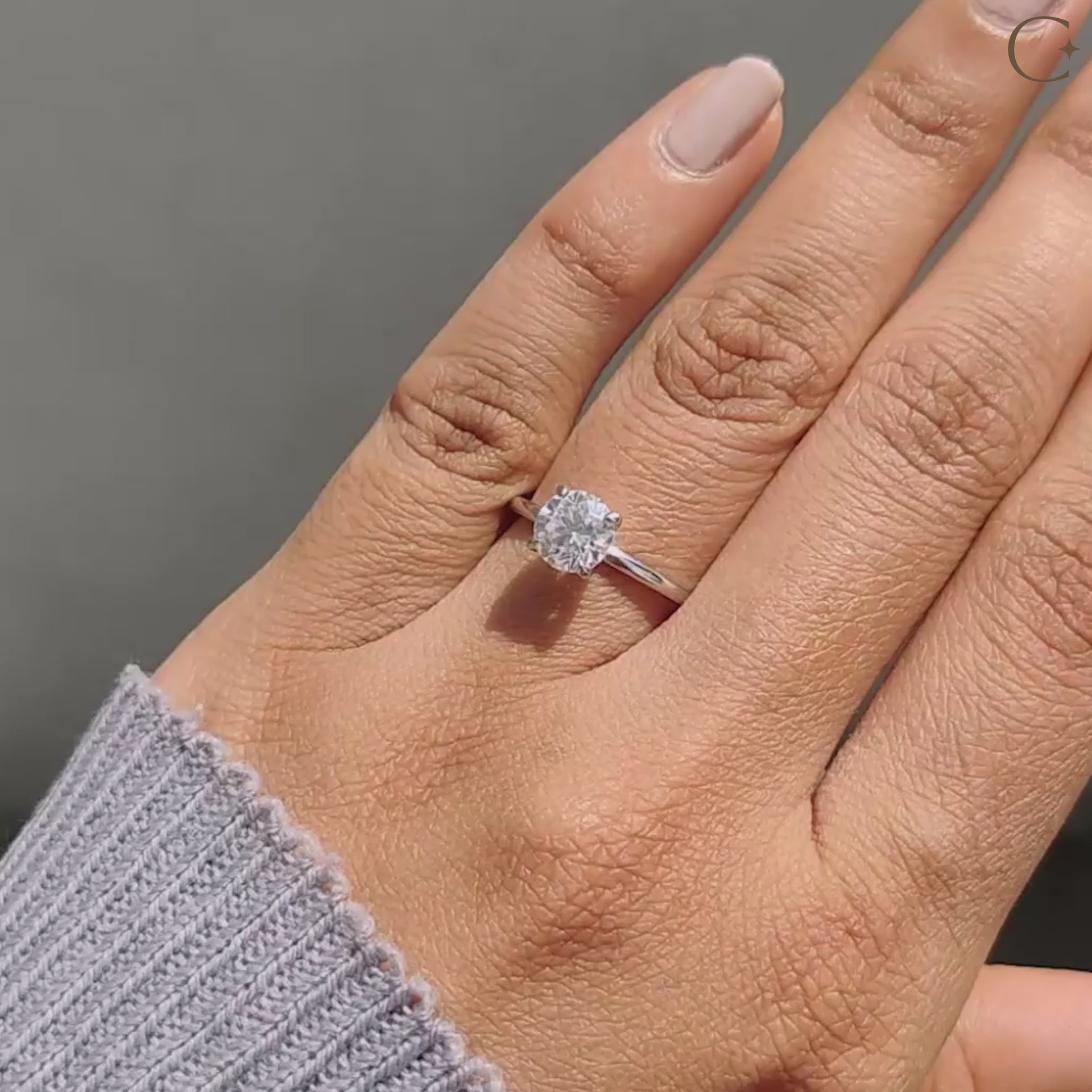 Solitaire engagement ring featuring a 4 prong claw setting and white gold band.
