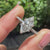 Pave setting ring with cathedral set engagement ring.