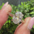 Round cut hidden halo solitaire engagement ring.
