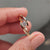Round cut diamond ring sparkling in natural light.
