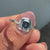 Bezel setting surrounds gems with strong bold shine.