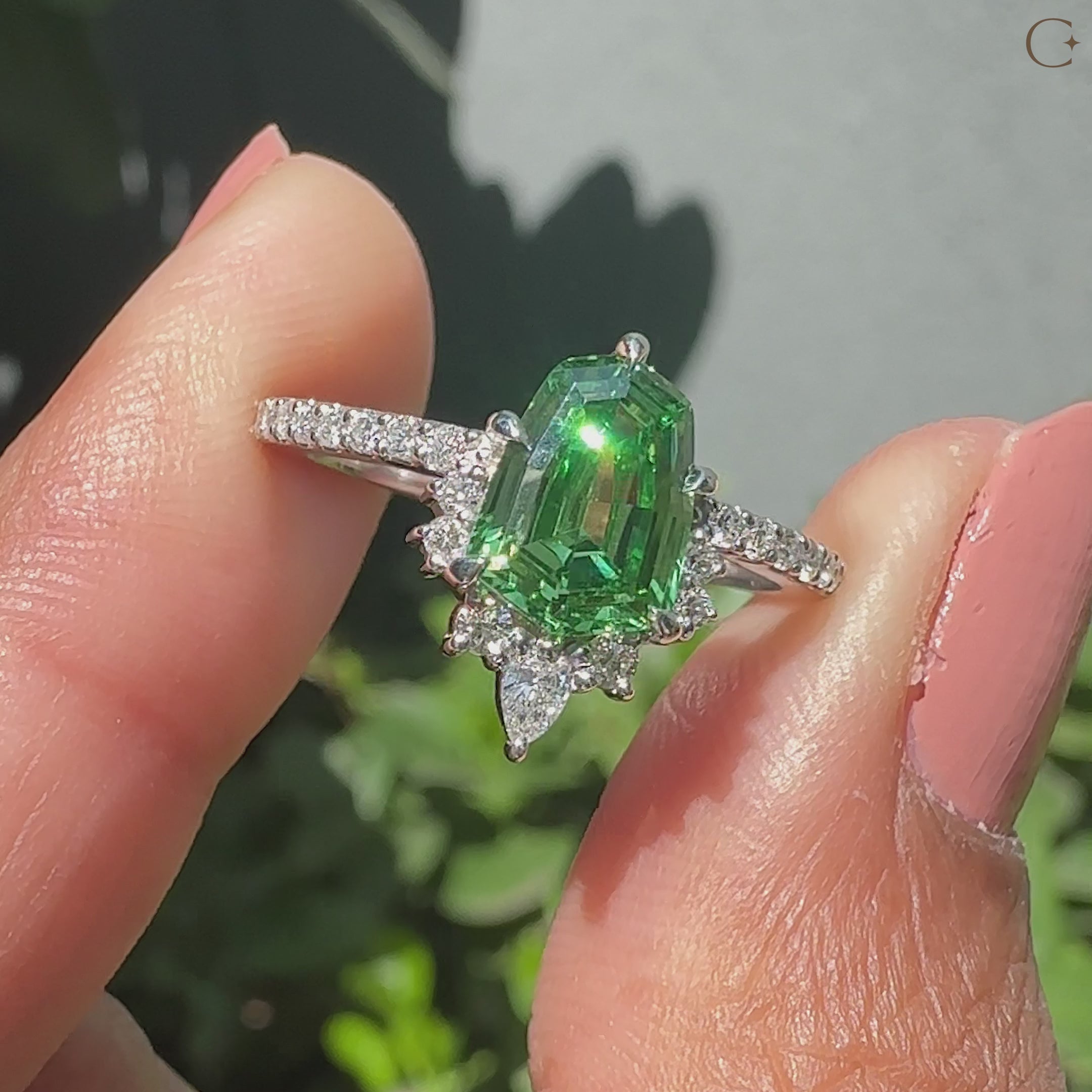 Pear and round side stone in 5 claw prong setting.