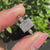 3 Stone Diamond Ring featuring a radiant cut diamond with marquise side stones.
