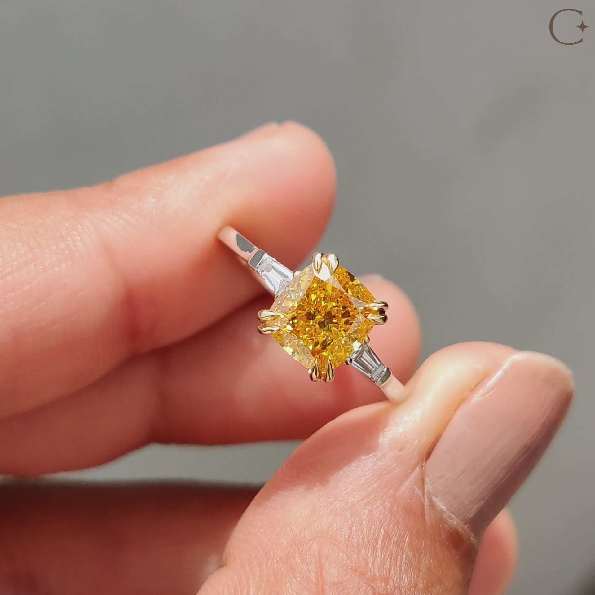 Yellow cushion diamond ring in a classic design.
