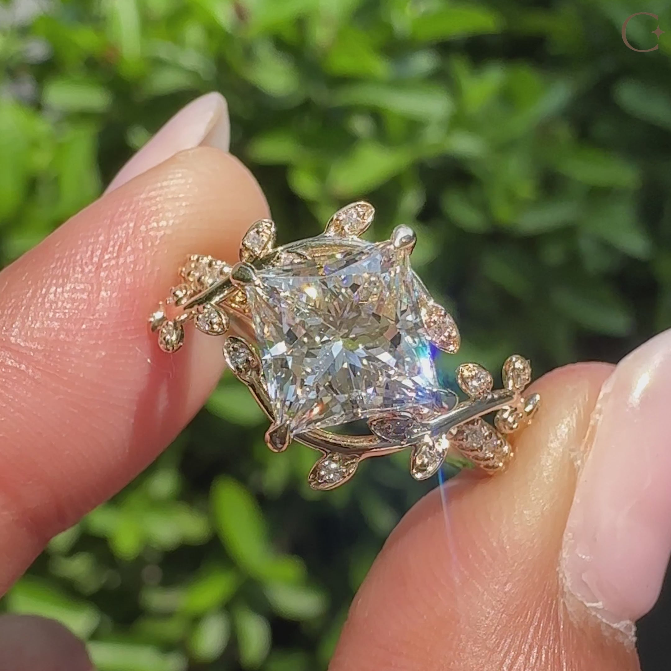 Princess cut center diamond with round cut pave accents.
