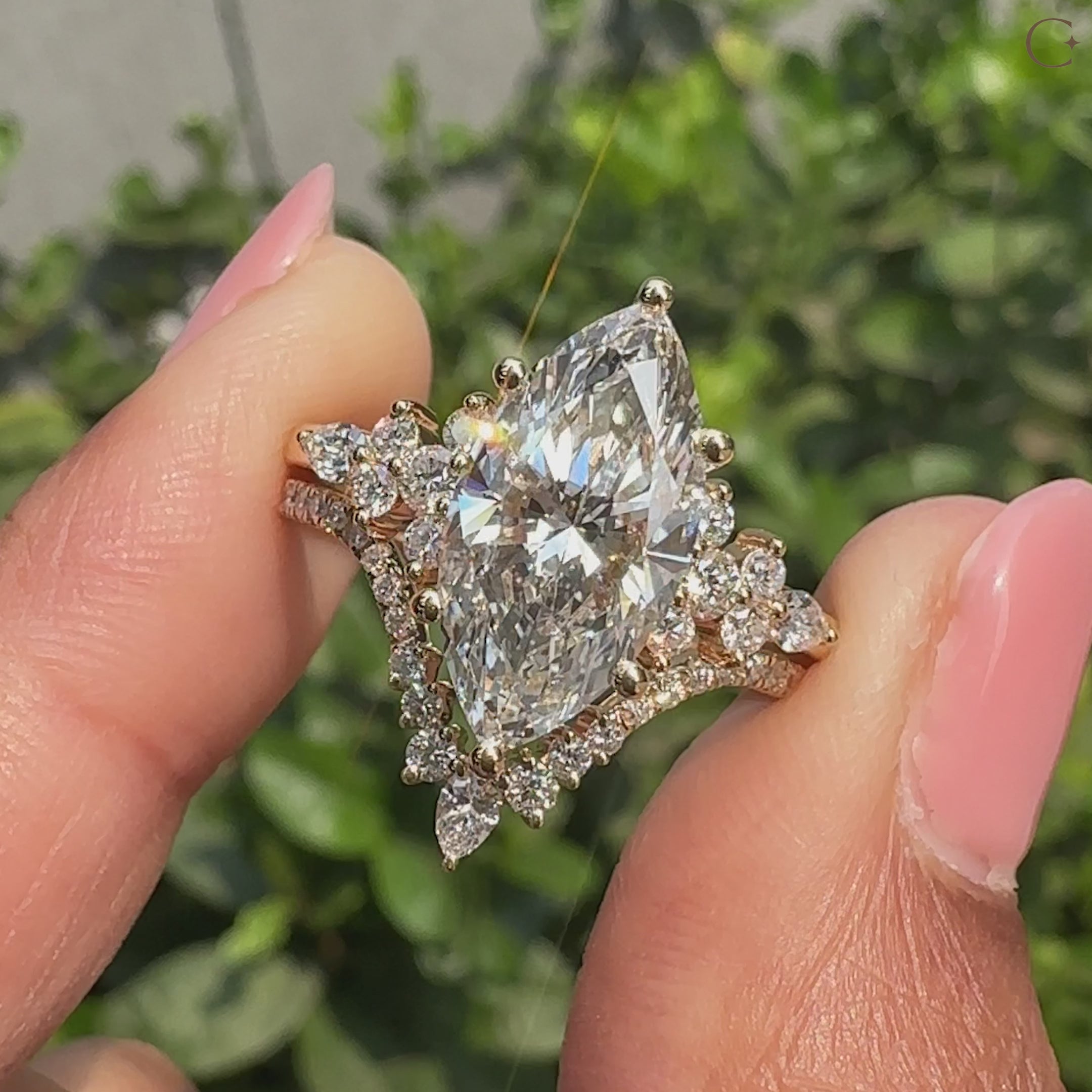 Marquise ring bridal set with pear and round side stones.
