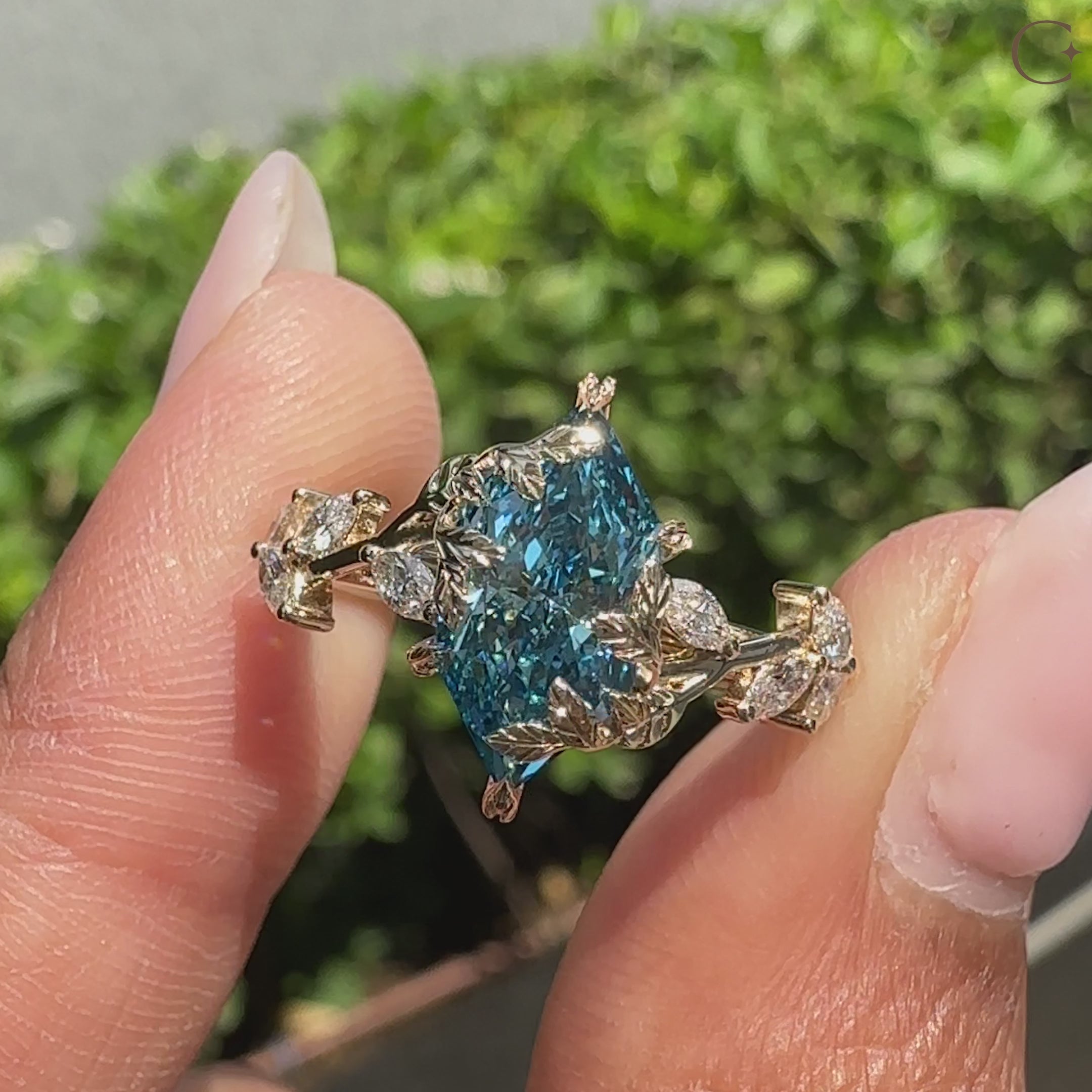 Nature inspired engagement ring with blue Dutch marquise diamond.
