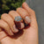 Oval cut ring in a white gold solitaire design.
