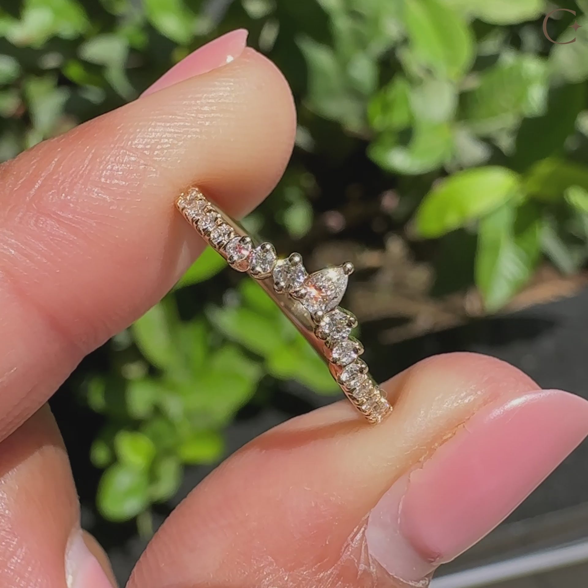 Round and pear diamond band featuring lab grown diamonds.
